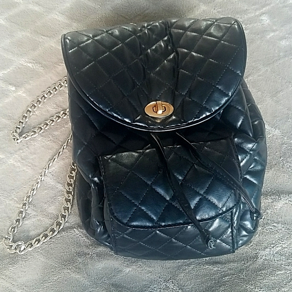 Black quilted backpack purse with rose gold straps